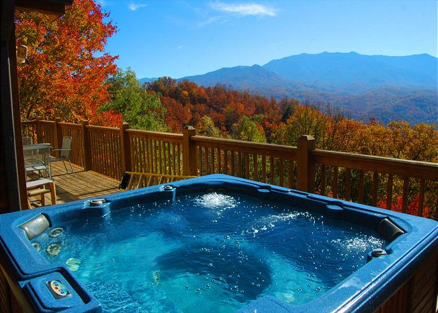 Fall foliage in the Smoky Mountains visible from a hot tub at a Gatlinburg cabin with mountain views.