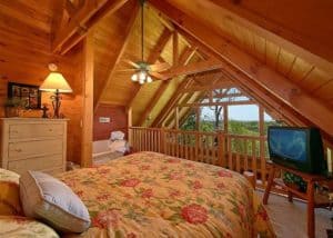 The bedroom in the American Dream cabin rental in Pigeon Forge.