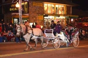 A horse drawn carriage in the Gatlinburg Christmas Parade