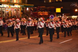 A marching band in holiday costumes in the Gatlinburg Christmas Parade