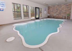 An indoor swimming pool in a Pigeon Forge cabin.