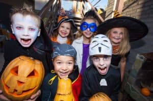 Costumed kids celebrating Halloween.