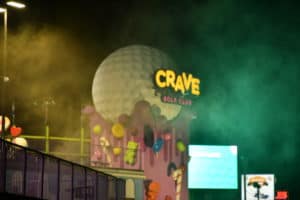 crave golf club sign at night