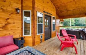 deck of 1 bedroom Pigeon Forge cabin with a hot tub and fire pit